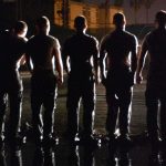 Army’s Digital Overhaul: Training Redefined Silhouettes of uniformed individuals standing in formation at night