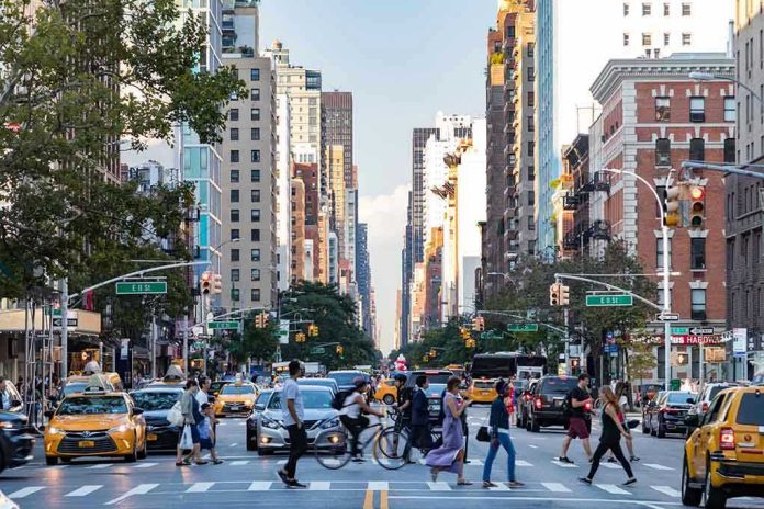 City street with pedestrian crossing and traffic.