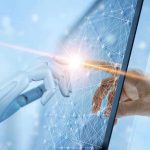 Robotic and human hands touching through a screen.