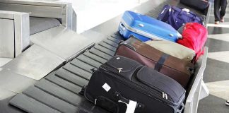 Various suitcases on an airport luggage carousel
