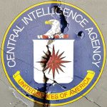 CIA Operatives DIE in Mexico—President Knew NOTHING Cracked CIA logo on weathered wall.
