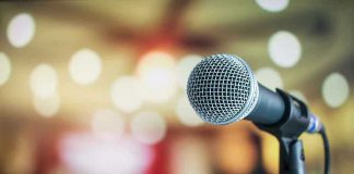 Microphone with blurred lights in the background.