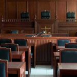 DEATH ROW DRAMA: Jury-Bias Twisted! Empty courtroom with wooden furnishings and judges bench.