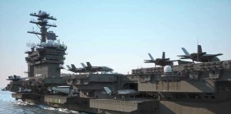 Iranian Retaliation Looms After US Strikes Aircraft carrier deck with jet planes.