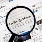 NYT Accused of Hamas Ties—Explosive Allegation! Magnifying glass over The New York Times website.