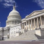 Fed Drama: FINANCIAL Crisis Veteran Returns The U.S. Capitol building with its dome and columns under a blue sky