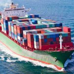 Hormuz ATTACK – What They’re Not Telling You! A large cargo ship loaded with colorful containers sailing on the ocean