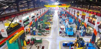 Staten Island Fire Horror: What’s Behind It? Aerial view of a large industrial workshop filled with various machinery and equipment