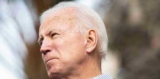 Privacy Shield Cracks — Biden Audio Coming Man holding microphone, looking to the side.
