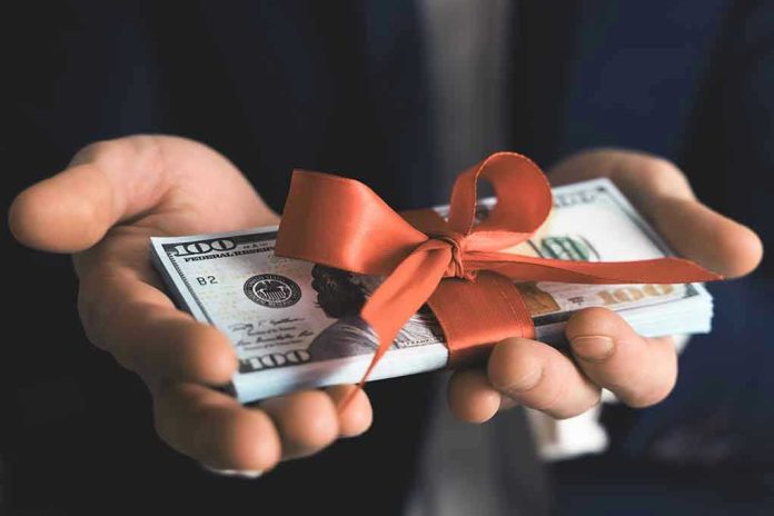 1690384846 Hands holding stack of hundred-dollar bills with ribbon.