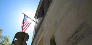ISIS Drone Cash Plot—Ex-Navy Tied In? American flag at Department of Justice building exterior.