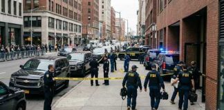 FBI agents conducting an operation at a city street crime scene