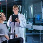 Scientist monitoring brain activity of a patient.