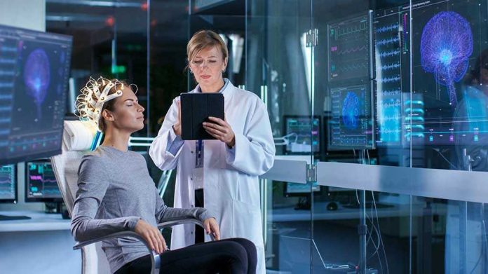 Scientist monitoring brain activity of a patient.