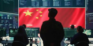 Terrifying Surge: AI Turbocharges Cybercrime Military personnel in control room, Chinese flag displayed.