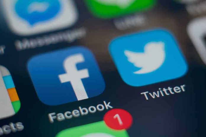 shutterstock_1045875784 Smartphone screen showing social media app icons