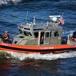 U.S. Coast Guard patrol boat speeding on open water