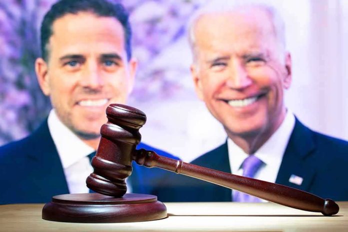shutterstock_2399061781 Judge’s gavel with two blurred people in the background