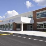 Parents Kept Dark After Fentanyl Chaos Modern school building with large windows and a clear sky