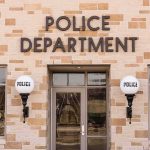 Police department building entrance with signage