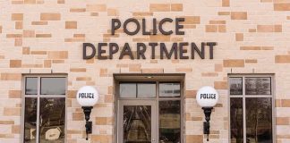 Police department building entrance with signage