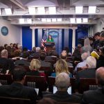 Press secretary speaks at White House briefing room podium