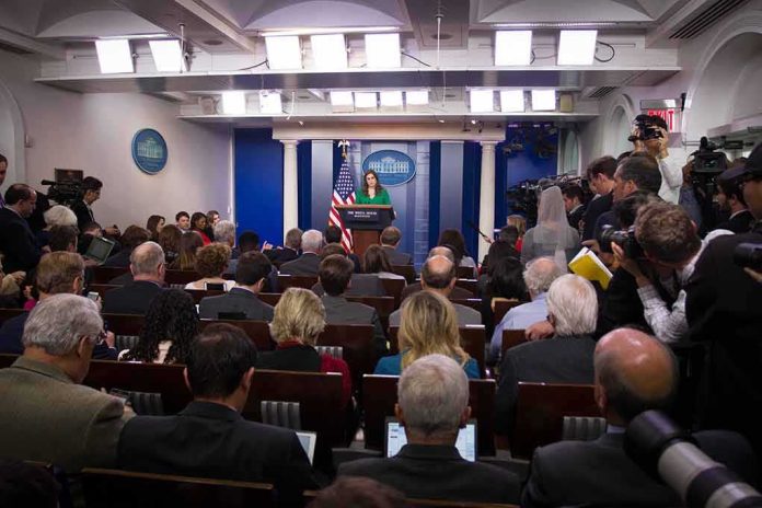shutterstock_744405130 Press secretary speaks at White House briefing room podium