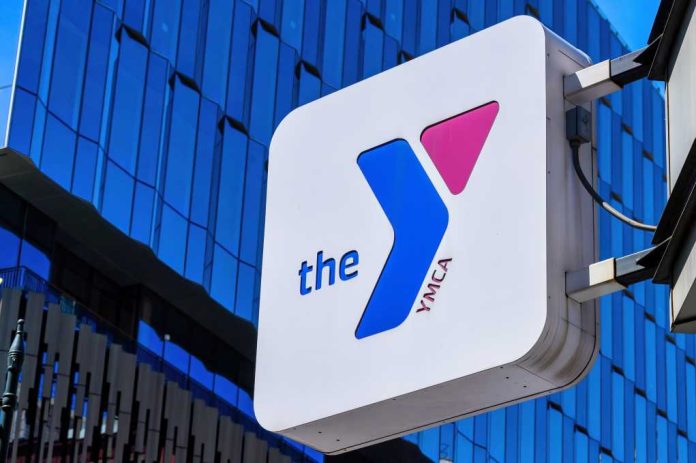 the-YMCA-sign_2497569731 YMCA sign mounted on a modern glass building