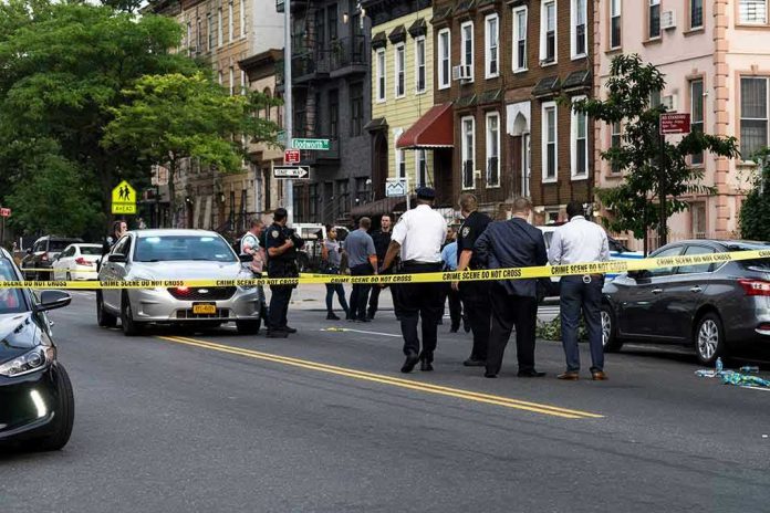 Police gathered at an urban crime scene.