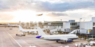 Airline Nightmare: Coke, Meth, Ecstasy Airplanes at airport gates during sunset with ground vehicles and jet bridges