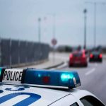 Outdated Alert Triggers Armed I-94 Standoff Police car with blue lights on near a roadway