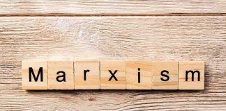 wooden letter tiles spelling a word on a rustic wood surface