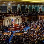 Power Grab: Iowa Knocked Off Pedestal legislative chamber filled with seated members during a session