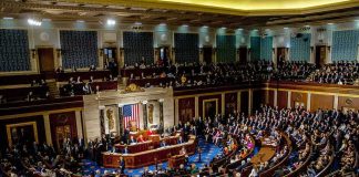 Power Grab: Iowa Knocked Off Pedestal legislative chamber filled with seated members during a session