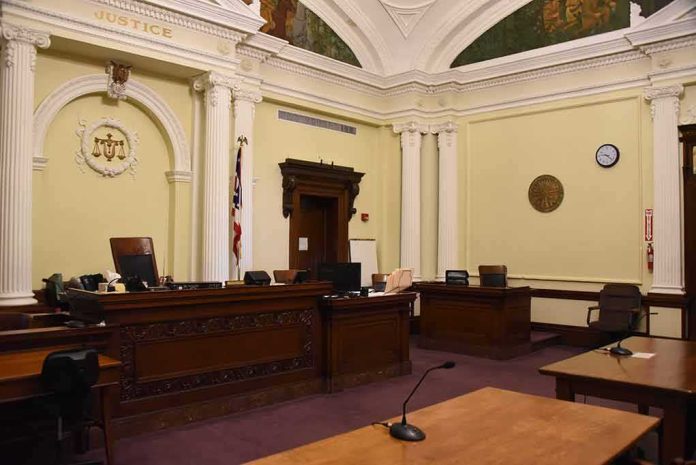 empty courtroom with judge's bench and columns