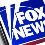 Fox Anchor’s COVID Booster Scare Fox News logo displayed on a smartphone screen