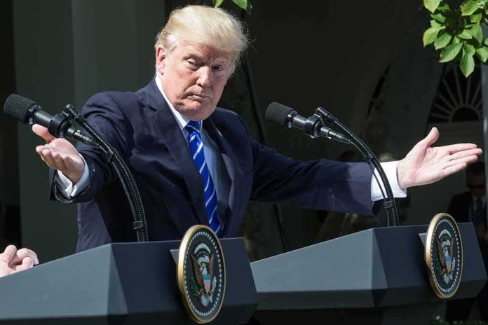man at podiums with arms outstretched during outdoor press event