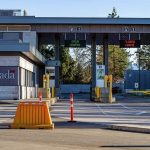 Canada border crossing booths with open and closed lane signs