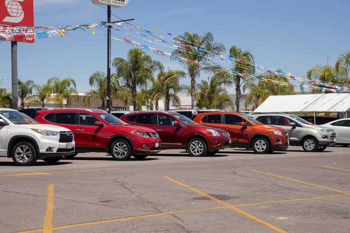 shutterstock_1738460453 row of SUVs at a car dealership lot