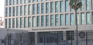 Embassy Locks Down Mexicali — Ominous Silence Embassy building behind tall black security fence