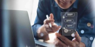Goodbye Screens: OpenAI’s Talking Box? Person using smartphone with chat bubbles and laptop