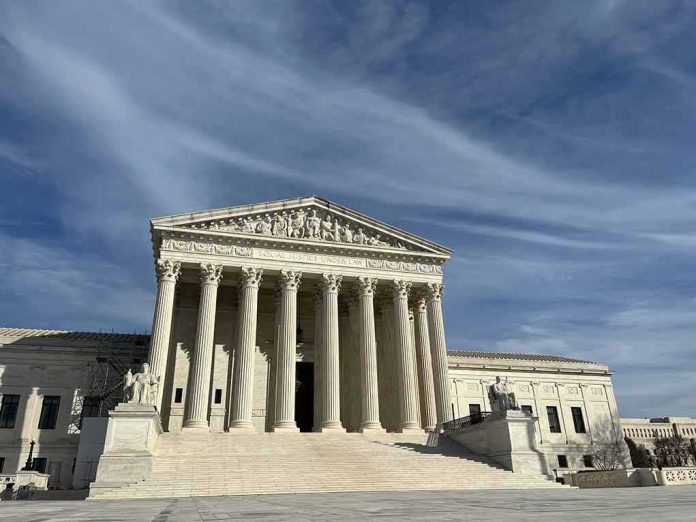 Supreme Court building with grand columns under a blue sky