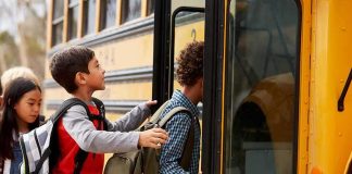 Highway 49 School Bus Meltdown Sparks Arrest Children boarding a yellow school bus