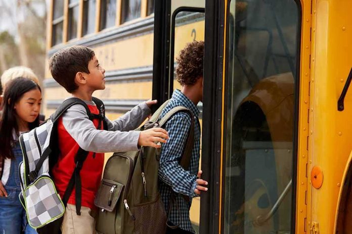 Children boarding a yellow school bus