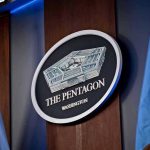 Why Trump Bypassed Ground Zero Today The Pentagon emblem between two flags.