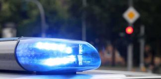Police Boss Detained – Chilling Charges Emerge Police car blue siren light flashing