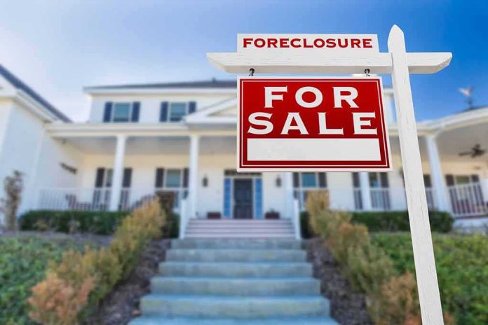 shutterstock_1010611816 For sale sign in front of suburban house