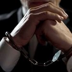 Tech CEO’s Ponzi Twist Stuns Businessperson in handcuffs with hands clasped
