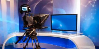 Television studio with camera and news desk