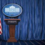 Showdown: Trump Welcomes China’s Xi Jinping White House press briefing podium with U.S. flag and blue curtain